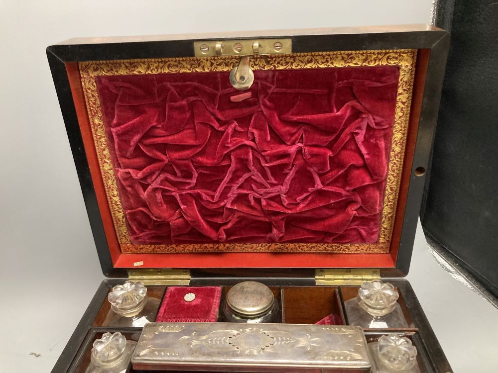 A Victorian rosewood dressing case, with mother of pearl entablature and plate-mounted glass fitments, width 30cm, depth 23cm, height 1